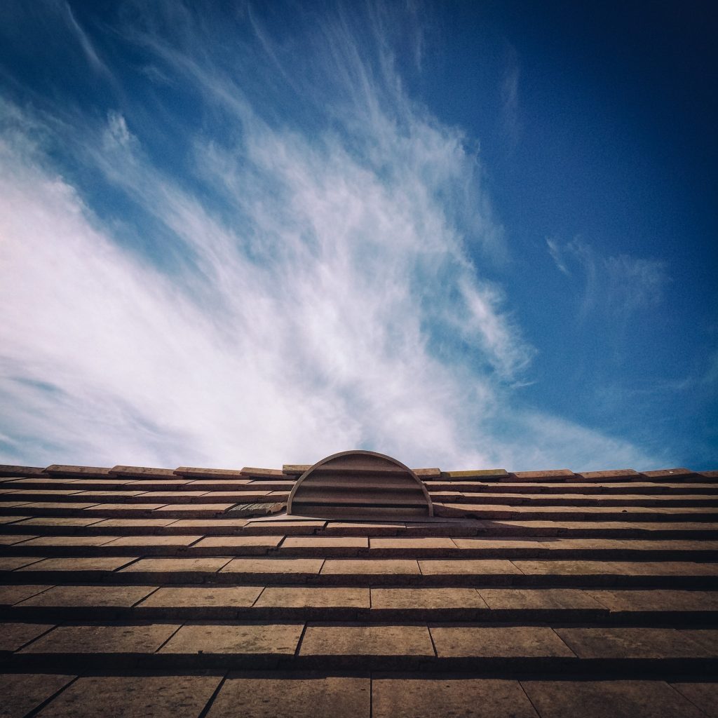 Roof vent with blue sky and cloud in the background